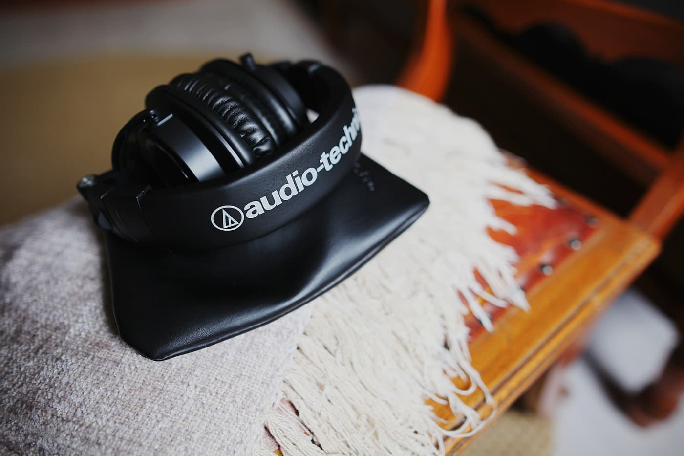 Premium wireless headphones in a modern interior setting